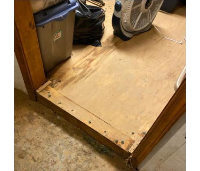 A raised wood floor suffered some water damage