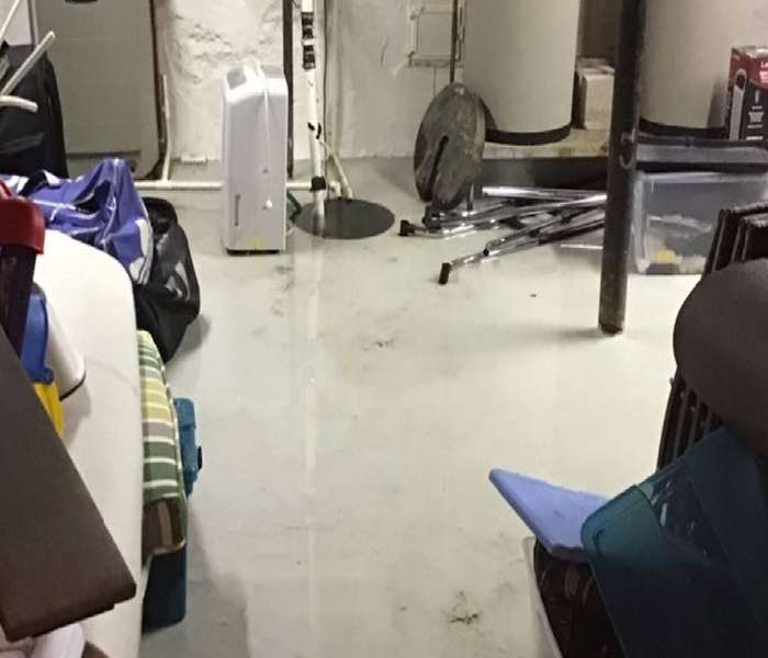 SERVPRO dehumidifier on dry basement floor