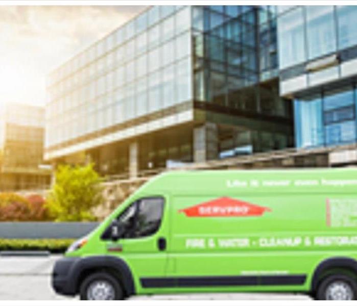 A photo of a SERVPRO van in front of a commercial building