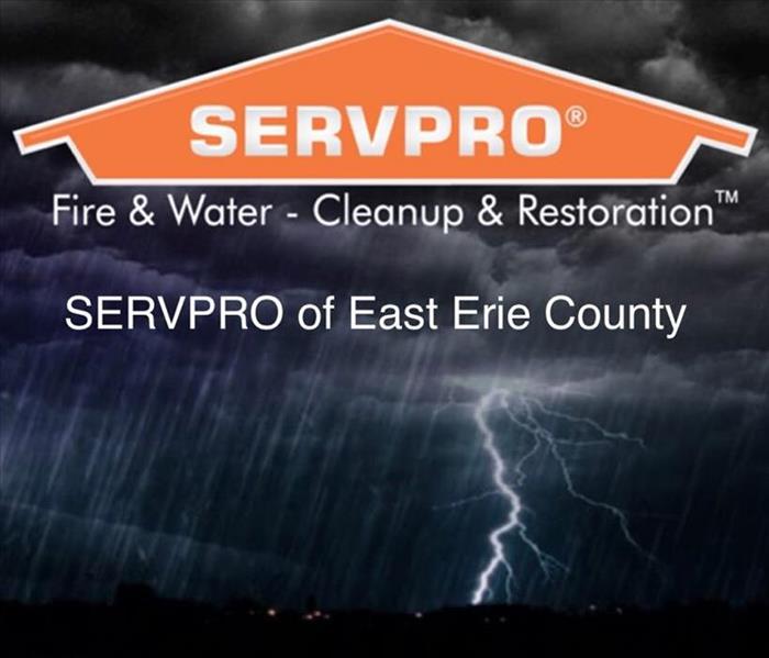 A photo showing the SERVPRO logo with a storm scene in the background.